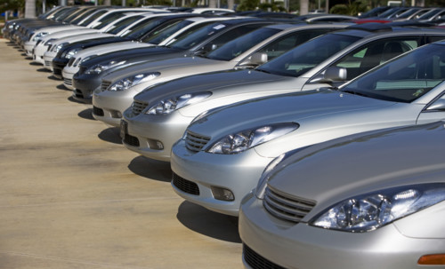 Row of new cars on lot. Date : 2007