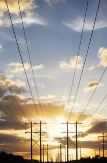 Electrical poles and wires at sunset. Date : 2007