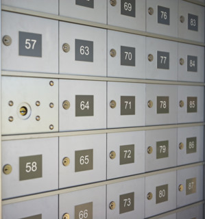 Wall of numbered mailboxes. Date : 2007