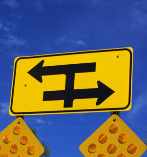 Low angle view of traffic direction sign. Date : 2007