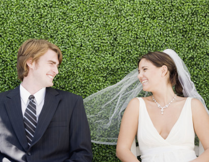 Bride and groom laying in grass. Date : 2007