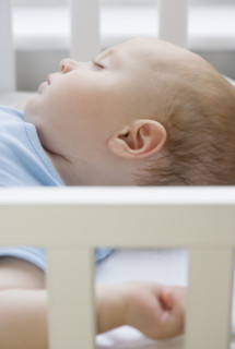 Baby sleeping in crib. Date : 2007