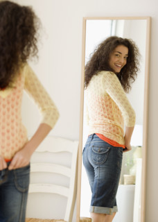 Woman looking in mirror