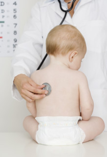 Doctor examining baby. Date : 2007