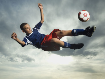 Low angle view of soccer player jumping. Date : 2007