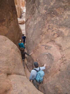 People walking through rock formations. Date : 2007