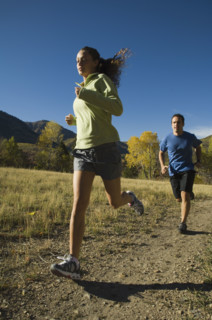 Couple jogging on trail, Utah, United States. Date : 2007