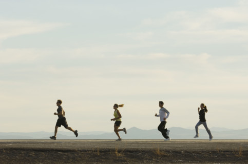 Group of people running on road, Utah, United States. Date : 2007