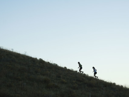 People running up mountain, Salt Flats, Utah, United States. Date : 2007