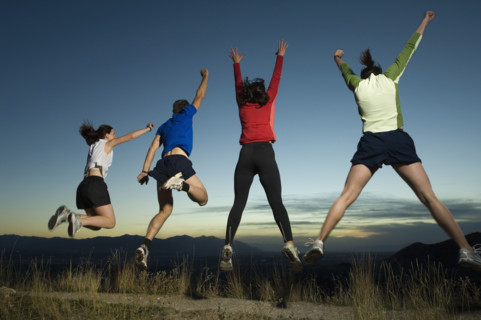 Rear view of people jumping, Salt Flats, Utah, United States. Date : 2007