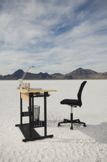 Desk with laptop on salt flats, Salt Flats, Utah, United States. Date : 2007