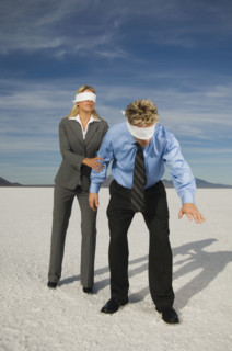 Blindfolded businesspeople on salt flats, Salt Flats, Utah, United States. Date : 2007