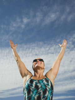 Female swimmer with arms raised, Utah, United States. Date : 2007