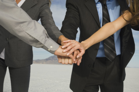 Businesspeople in huddle, Salt Flats, Utah, United States. Date : 2007