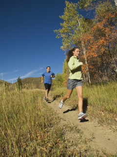 Couple jogging on trail, Utah, United States. Date : 2007