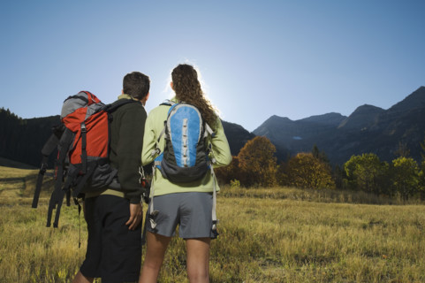 Couple wearing backpacks outdoors, Utah, United States. Date : 2007