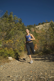 Woman jogging on trail, Utah, United States. Date : 2007