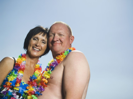 Couple wearing flower leis. Date : 2007