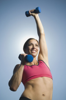 Woman lifting weights. Date : 2007