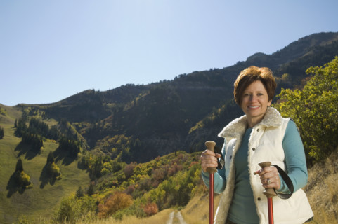Senior woman holding hiking poles, Utah, United States. Date : 2007