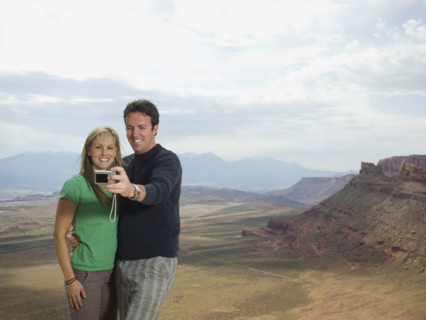Couple taking own photograph. Date : 2007
