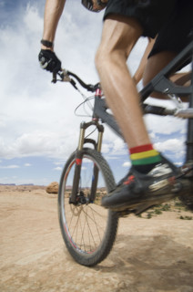 Low angle view of man riding mountain bike. Date : 2007