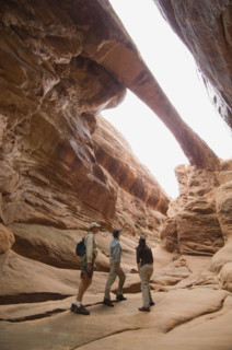 People looking up at rock formations. Date : 2007