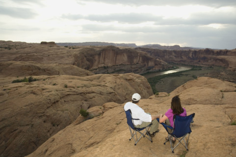 Couple in camping chairs over-looking canyon. Date : 2007