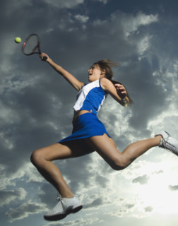 Low angle view of tennis player jumping. Date : 2007