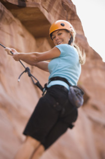 Close up of woman rock climbing. Date : 2007
