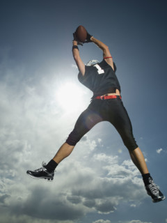 Low angle view of football player jumping. Date : 2007