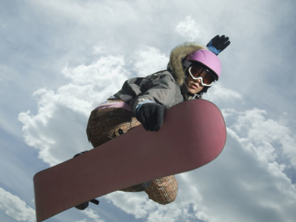 Low angle view of snowboarder jumping. Date : 2007