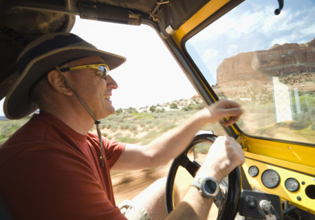 Man driving in desert. Date : 2007