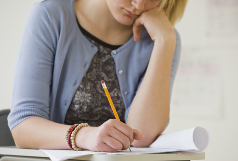 Teenaged girl doing homework.
