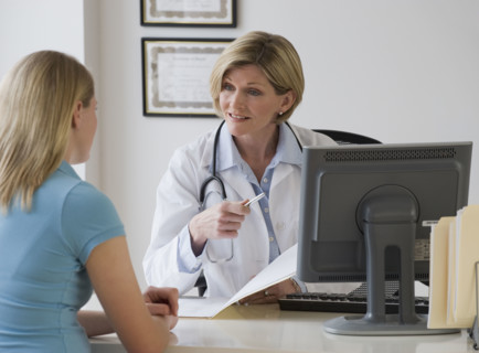 Female doctor talking to patient.