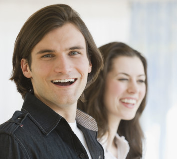 Close up of couple laughing.