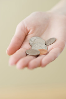 Coins in woman’s hand.