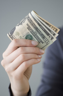 Money in woman’s hand.