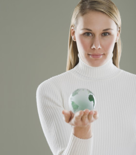 Woman holding glass globe.