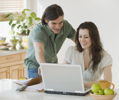 Couple looking at laptop.