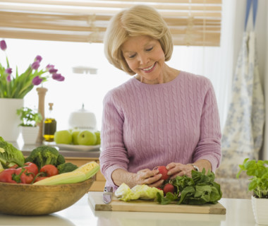 Senior woman looking at vegetables.