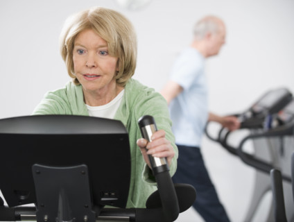Senior woman on exercise machine.