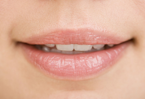 Close up of woman’s mouth.