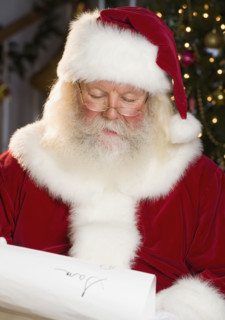 Santa Claus reading list of names.