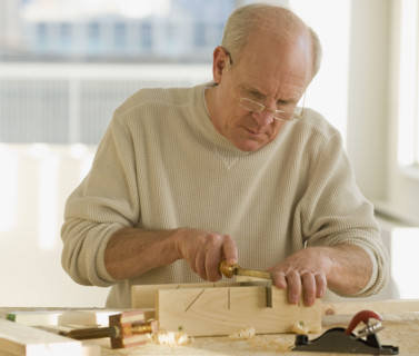 Senior man woodworking.