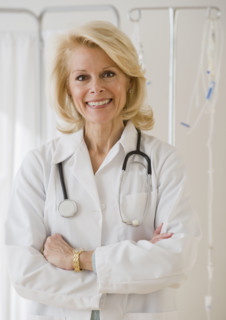 Female doctor with arms crossed.