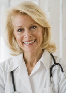 Female doctor with stethoscope around neck .