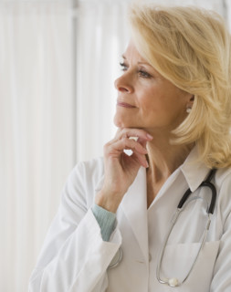 Female doctor thinking .