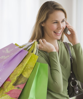 Woman carrying shopping bags.