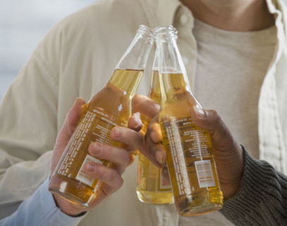 Multi-ethnic men toasting with beer.